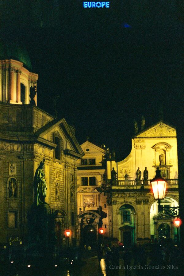 Historic building façade in Prague with ornate architectural details and street-level urban surroundings